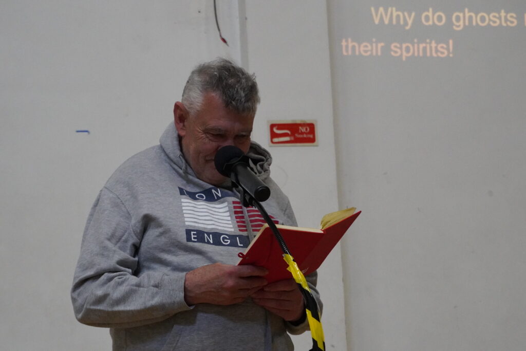 Lloyd Page reading his jokes