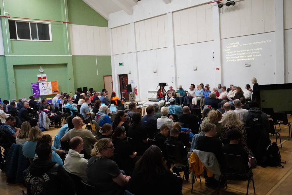 Audience watching Age UK Bromley and Greenwich Memory Singers